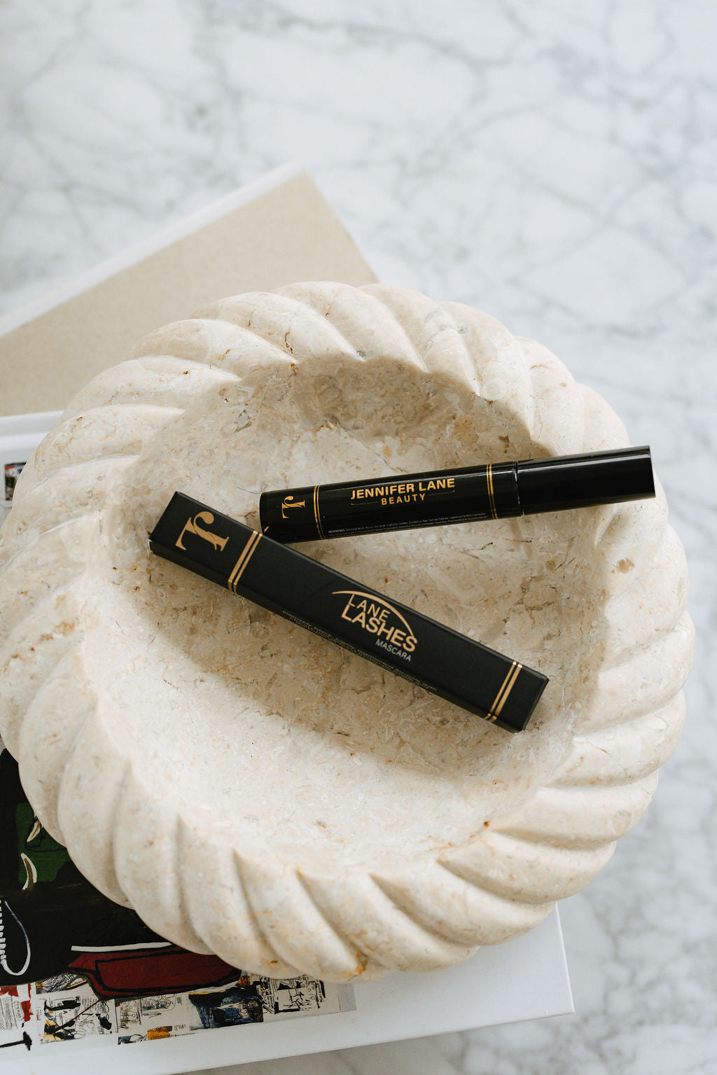 Jennifer Lane Beauty's Lane Lashes mascara box and tube.