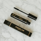 Jennifer Lane Beauty's Lane Lashes mascara on a white marble surface